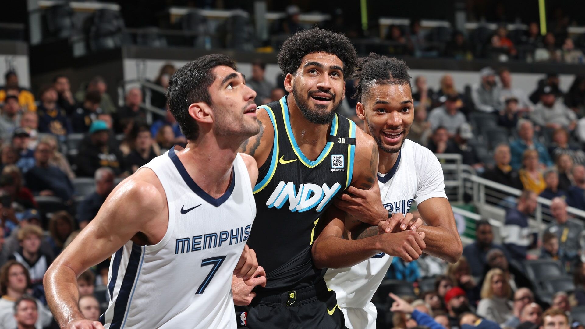 INDIANAPOLIS, IN - JANUARY 28: Ziaire Williams #8 of the Memphis Grizzlies and Obi Toppin #1 of the Indiana Pacers smile during the game on January 28, 2024 at Gainbridge Fieldhouse in Indianapolis, Indiana.