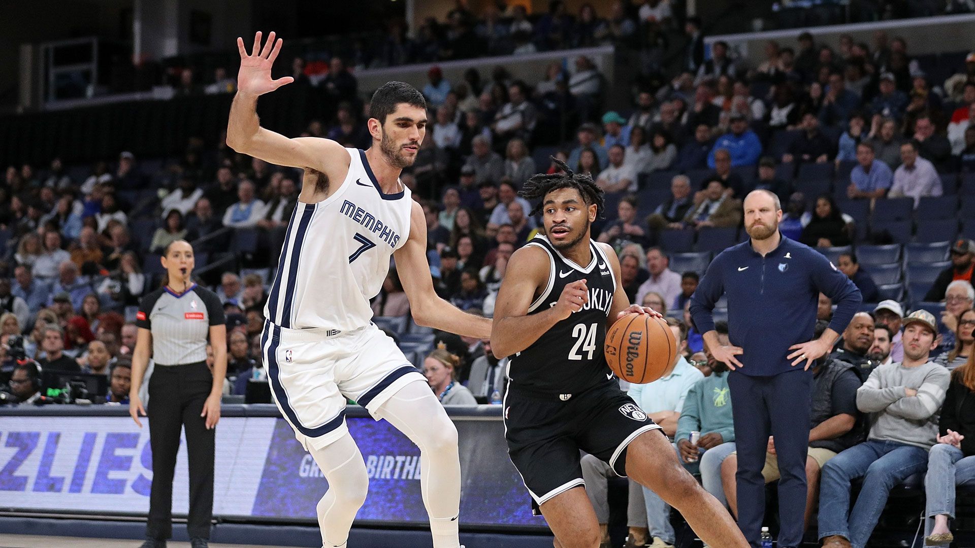 MEMPHIS, TENNESSEE - FEBRUARY 26: Santi Aldama #7 of the Memphis Grizzlies defends Cam Thomas #24 of the Brooklyn Nets during the game at FedExForum on February 26, 2024 in Memphis, Tennessee.