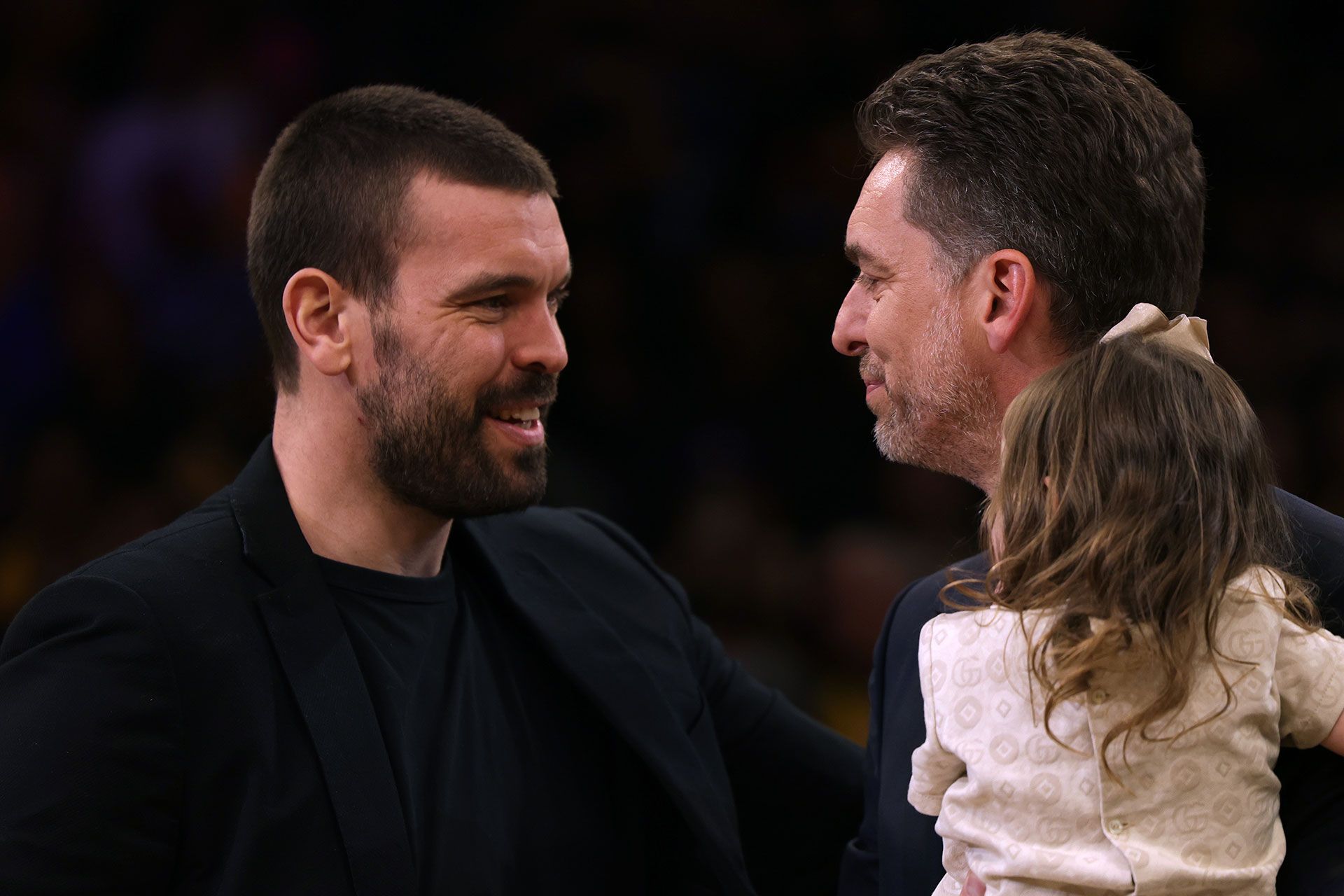 LOS ANGELES, CALIFORNIA - MARCH 07: (L-R) Marc Gasol smiles with his brother Pau Gasol #16 of the Los Angeles Lakers during his jersey retirement ceremony at halftime in the game between the Memphis Grizzlies and the Los Angeles Lakers at Crypto.com Arena on March 07, 2023 in Los Angeles, California.