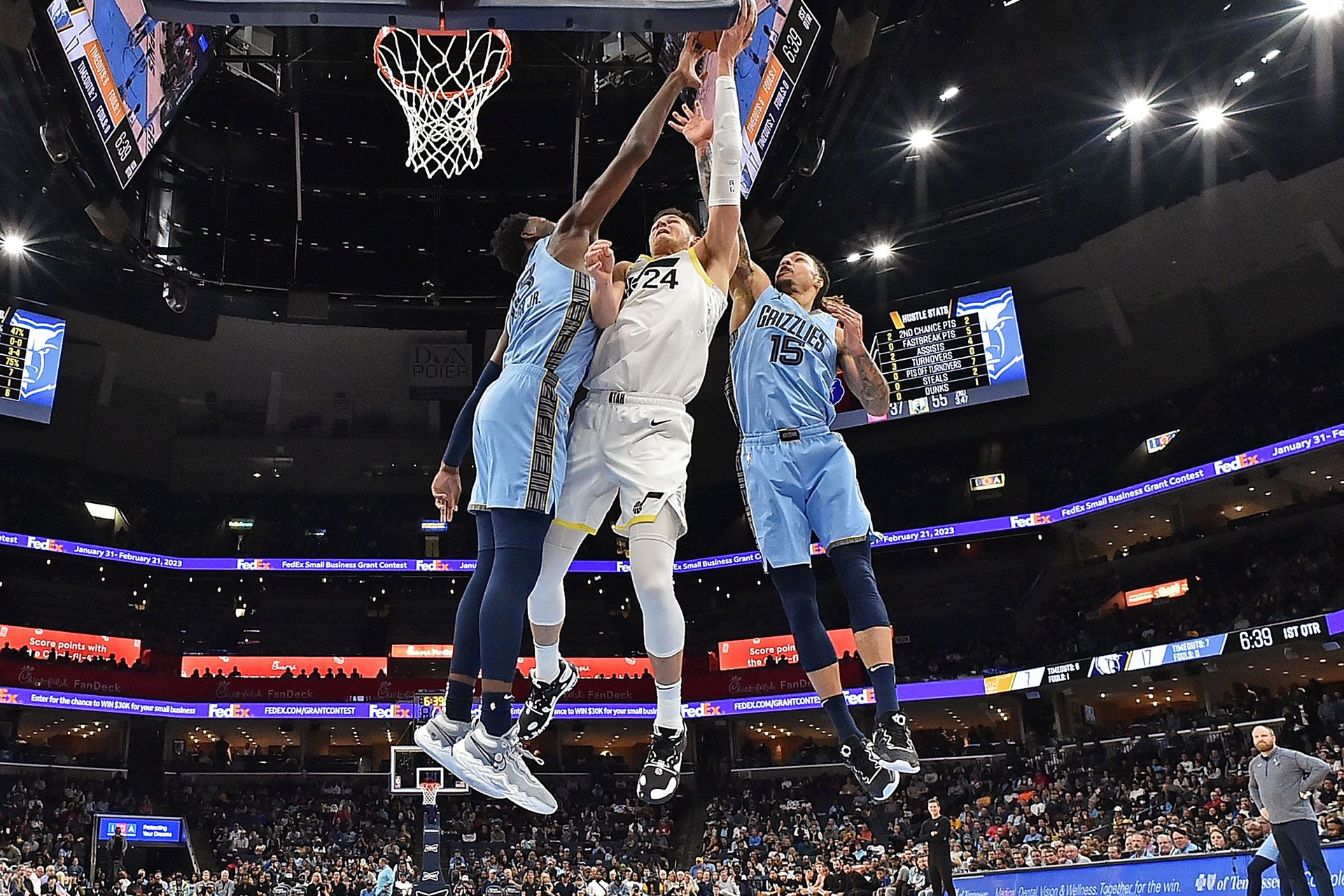 MEMPHIS, TENNESSEE - FEBRUARY 15: Jaren Jackson Jr. #13 and Brandon Clarke #15 of the Memphis Grizzlies challenge the shot of Walker Kessler #24 of the Utah Jazz during the game at FedExForum on February 15, 2023 in Memphis, Tennessee.