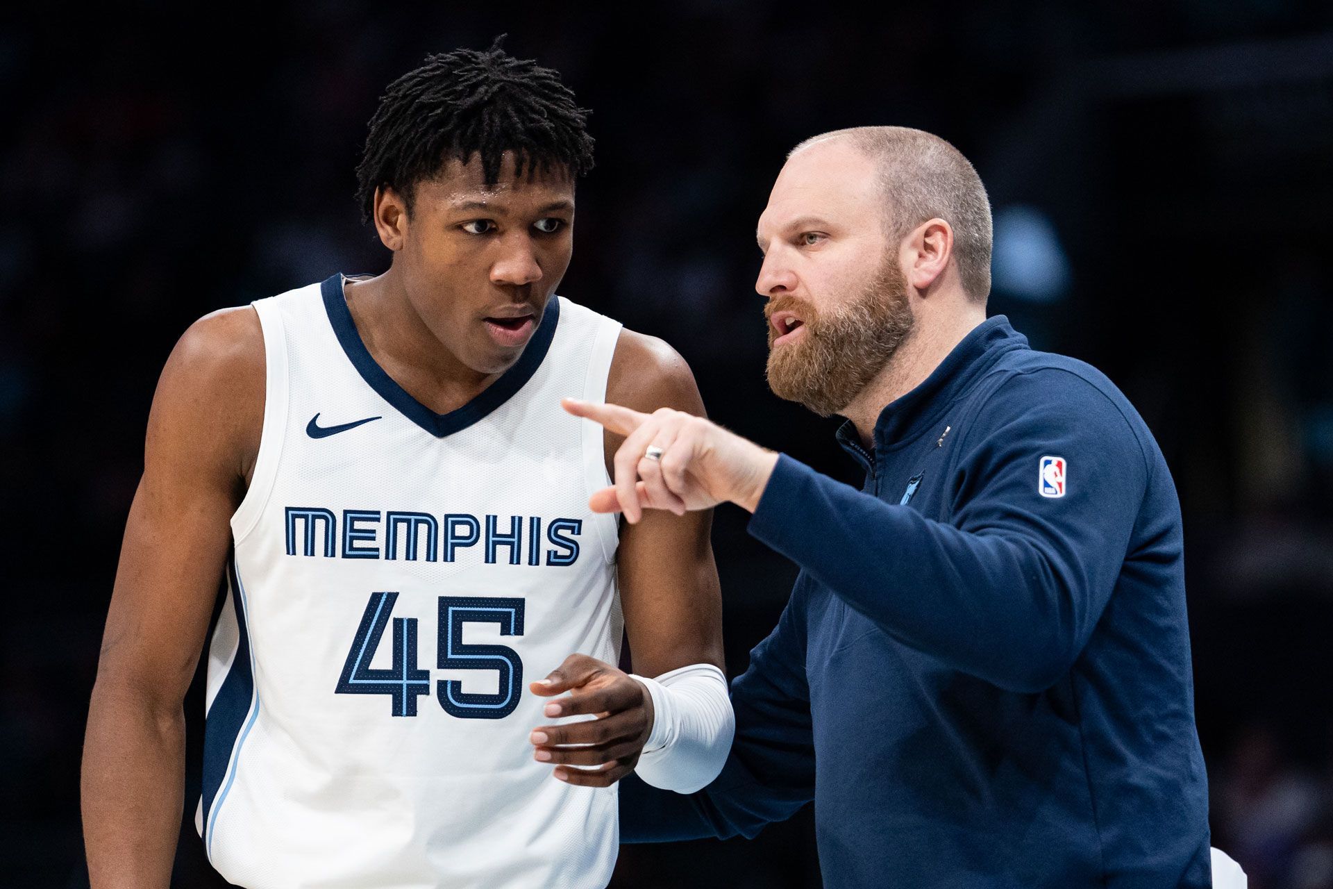CHARLOTTE, NORTH CAROLINA - FEBRUARY 10: Head coach Taylor Jenkins talks with GG Jackson #45 of the Memphis Grizzlies during their game against the Charlotte Hornets at Spectrum Center on February 10, 2024 in Charlotte, North Carolina.