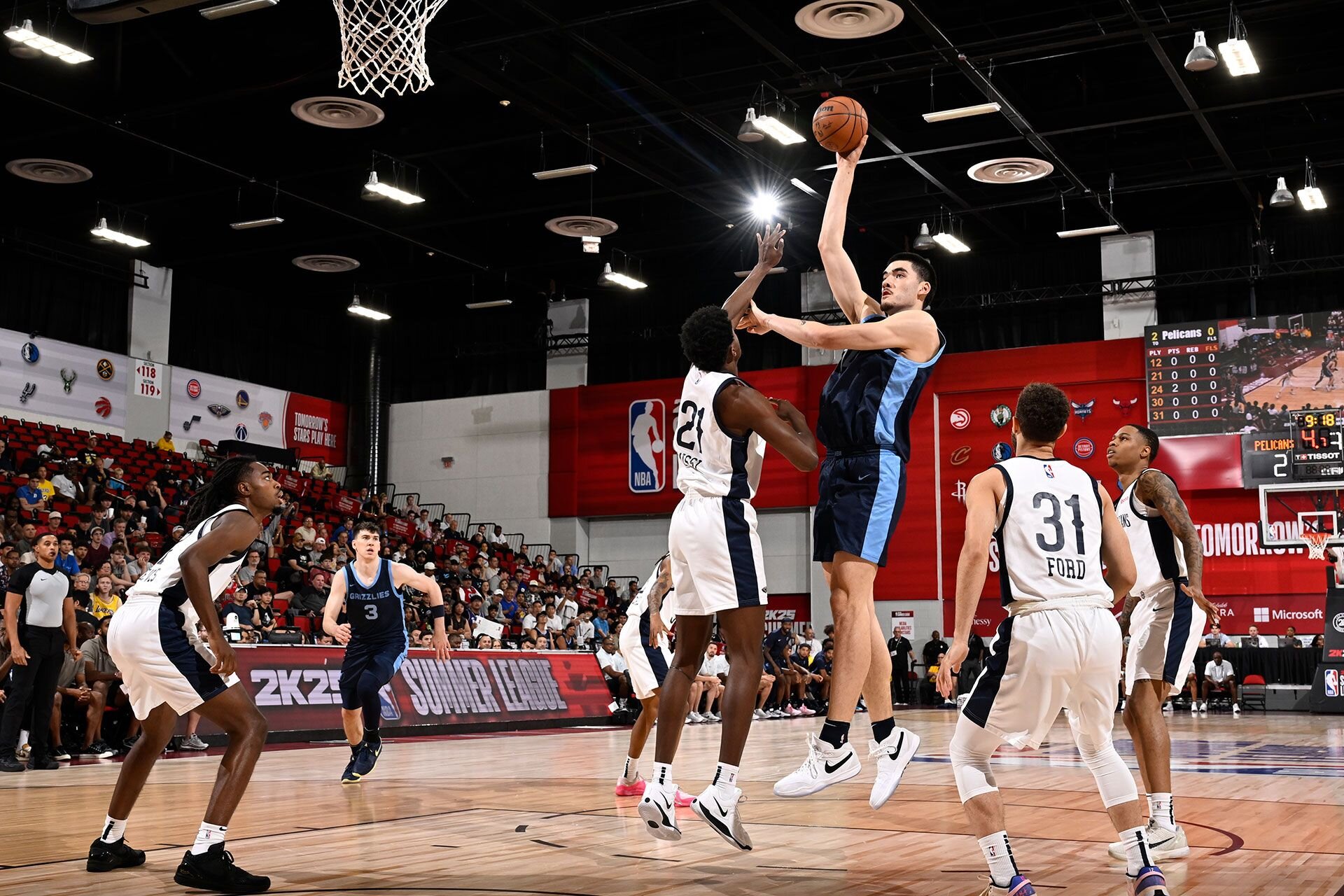 LAS VEGAS, NV - JULY 18: Zach Edey #14 of the Memphis Grizzlies shoots the ball during the game against the New Orleans Pelicans on July 18, 2024 at the Cox Pavilion in Las Vegas, Nevada.