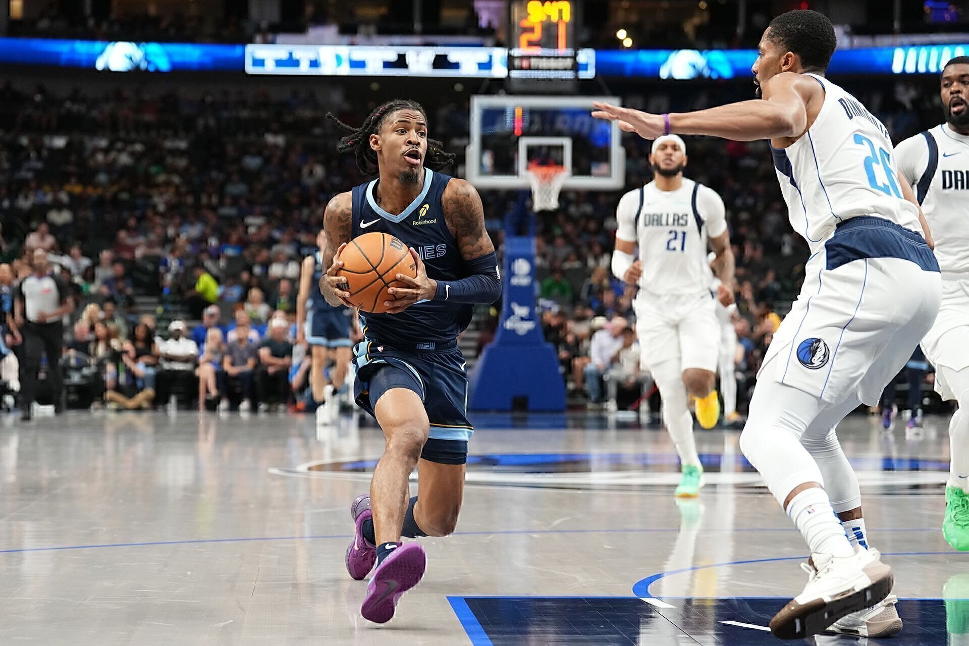 DALLAS, TX - OCTOBER 7: Ja Morant #12 of the Memphis Grizzlies dribbles the ball during the game against the Dallas Mavericks during the 2024 NBA Preseason on October 7, 2024 at American Airlines Center in Dallas, Texas.