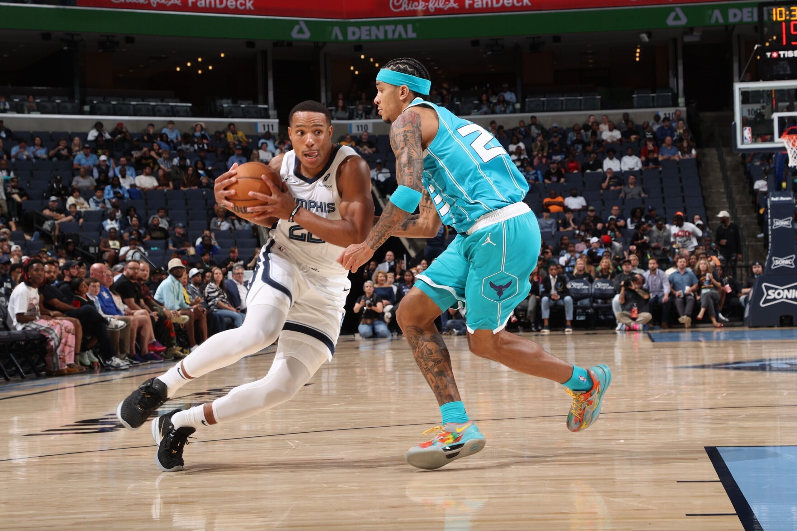 MEMPHIS, TN - OCTOBER 10: Desmond Bane #22 of the Memphis Grizzlies drives to the basket during the game against the Charlotte Hornets during a NBA Preseason game on October 10, 2024 at FedExForum in Memphis, Tennessee.