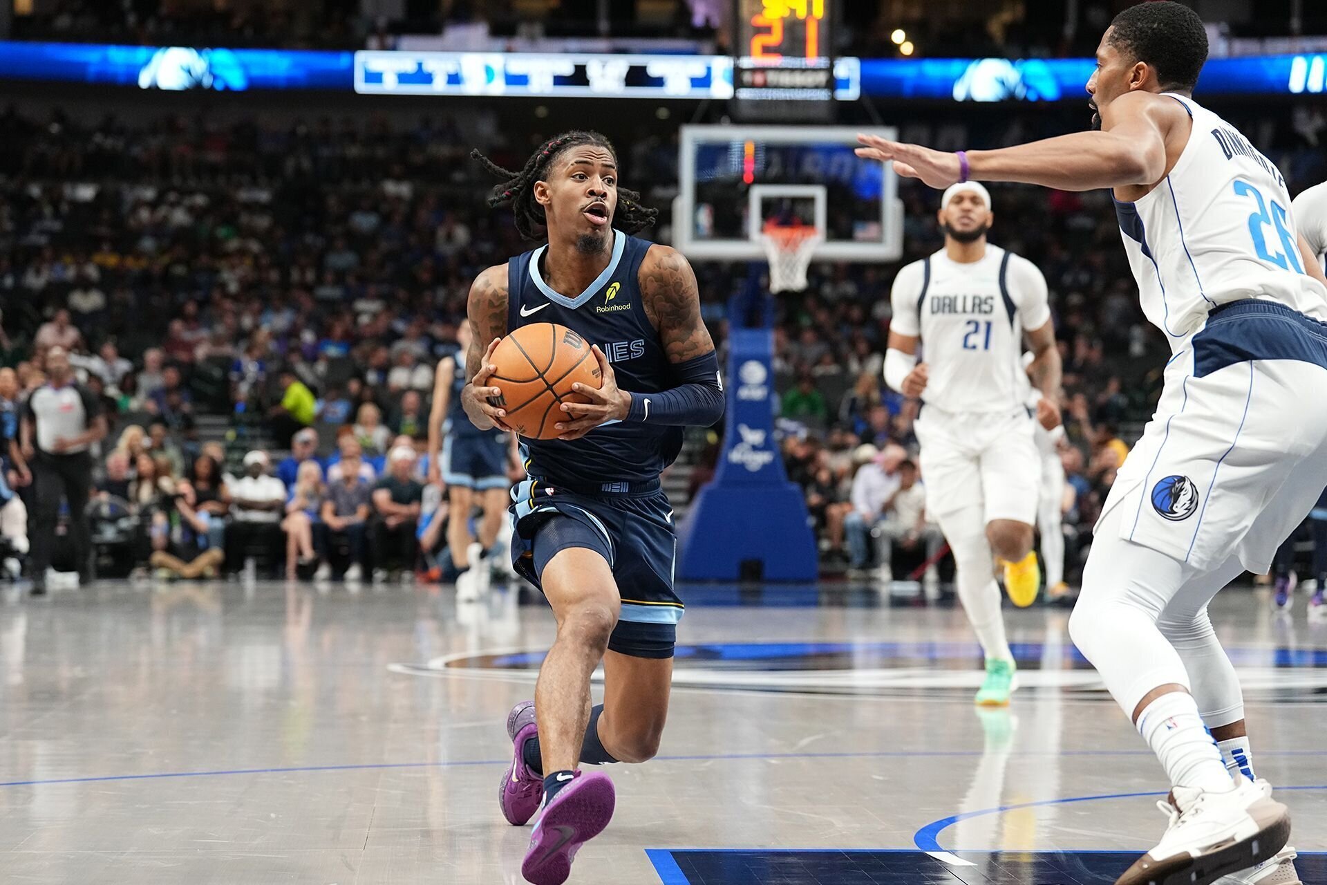 DALLAS, TX - OCTOBER 7: Ja Morant #12 of the Memphis Grizzlies dribbles the ball during the game against the Dallas Mavericks during the 2024 NBA Preseason on October 7, 2024 at American Airlines Center in Dallas, Texas.