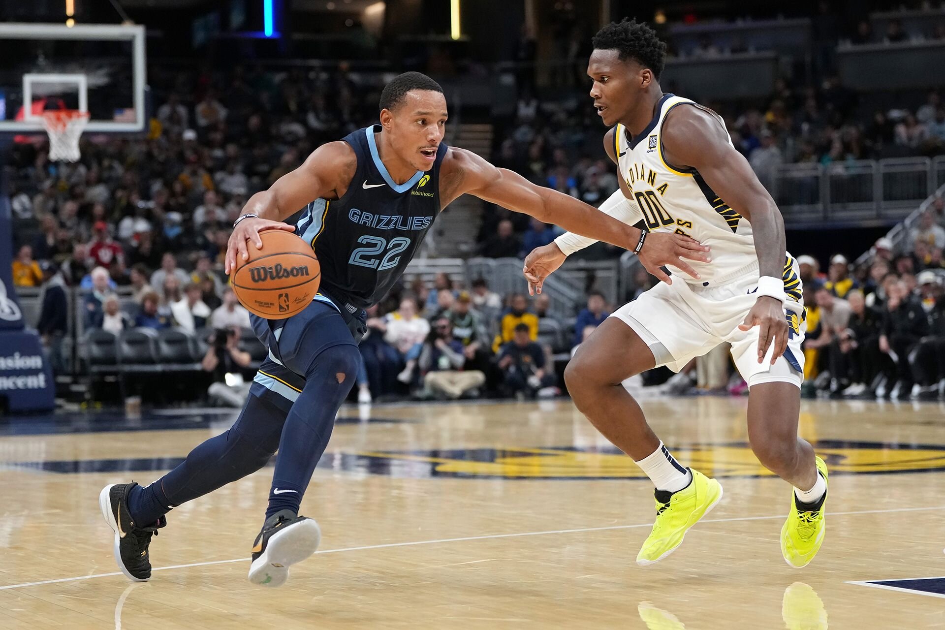 INDIANAPOLIS, INDIANA - OCTOBER 14: Desmond Bane #22 of the Memphis Grizzlies drives against Bennedict Mathurin #00 of the Indiana Pacers in the third quarter during a preseason game at Gainbridge Fieldhouse on October 14, 2024 in Indianapolis, Indiana.