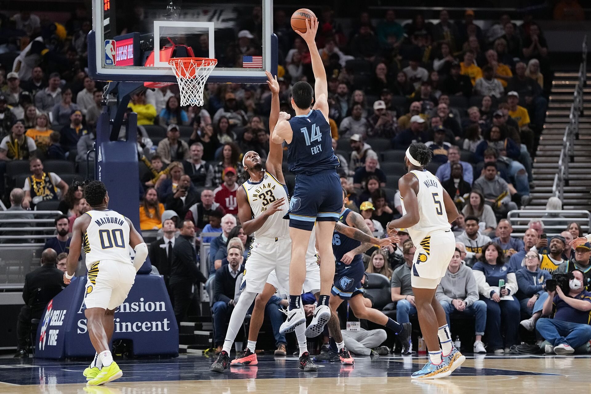 INDIANAPOLIS, INDIANA - OCTOBER 14: Zach Edey #14 of the Memphis Grizzlies attempts a shot while being guarded by Myles Turner #33 of the Indiana Pacers in the first quarter during a preseason game at Gainbridge Fieldhouse on October 14, 2024 in Indianapolis, Indiana.