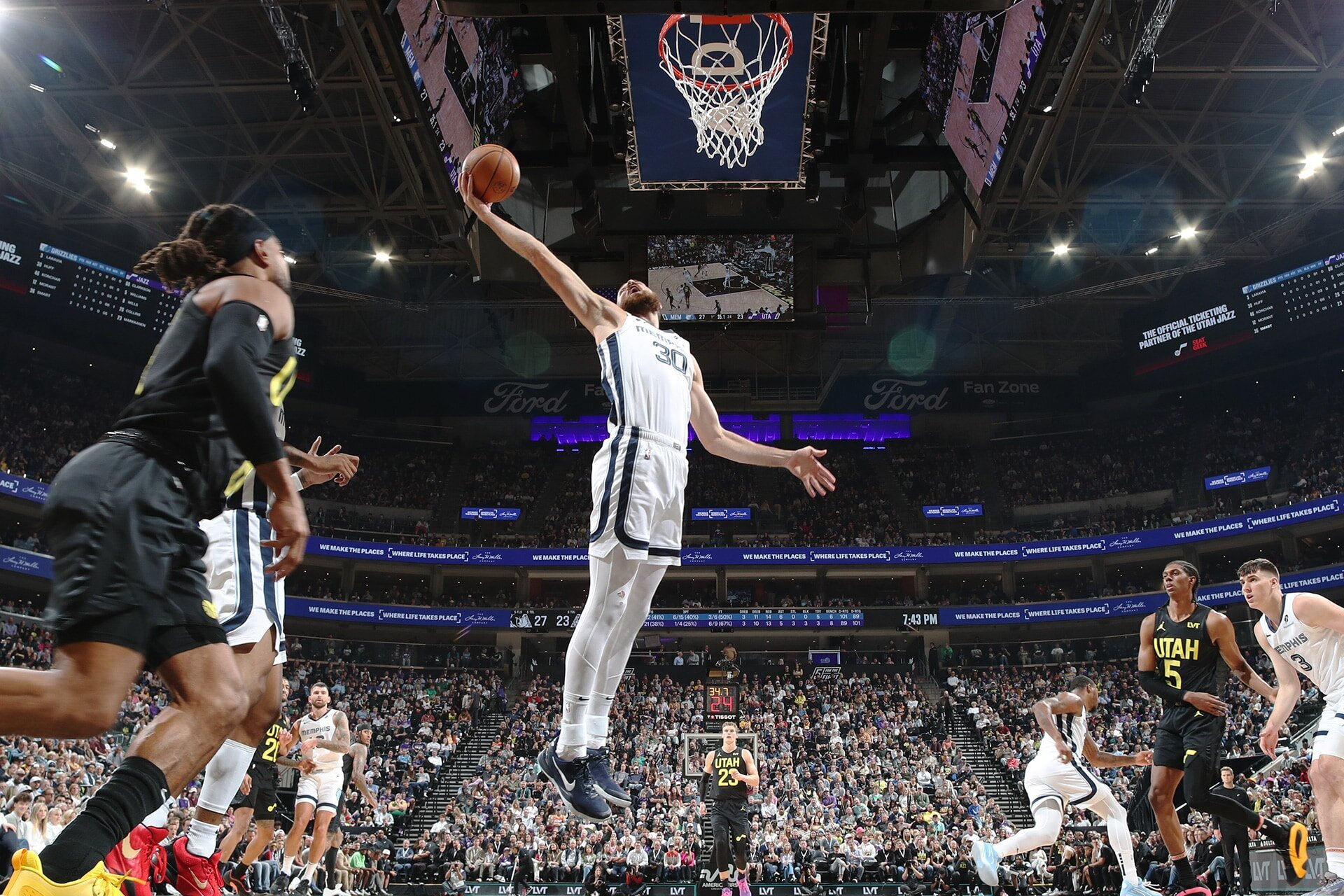 SALT LAKE CITY, UT - OCTOBER 23: Jay Huff #30 of the Memphis Grizzlies drives to the basket during the game against the Utah Jazz on OCTOBER 23, 2024 at vivint.SmartHome Arena in Salt Lake City, Utah.