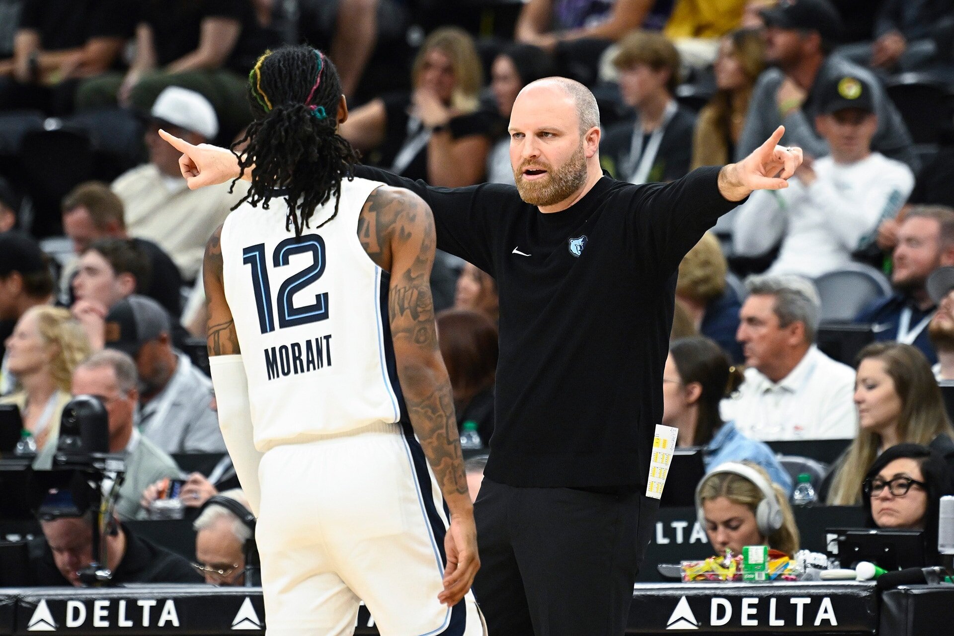 SALT LAKE CITY, UTAH - OCTOBER 23: Head Coach Taylor Jenkins of the Memphis Grizzlies speaks to Ja Morant #12 during the second quarter against the Utah Jazz at Delta Center on October 23, 2024 in Salt Lake City, Utah.