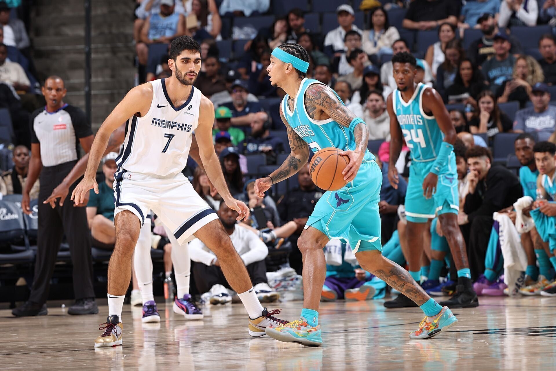 MEMPHIS, TN - OCTOBER 10: Santi Aldama #7 of the Memphis Grizzlies plays defense during the game against the Charlotte Hornets during a NBA Preseason game on October 10, 2024 at FedExForum in Memphis, Tennessee.