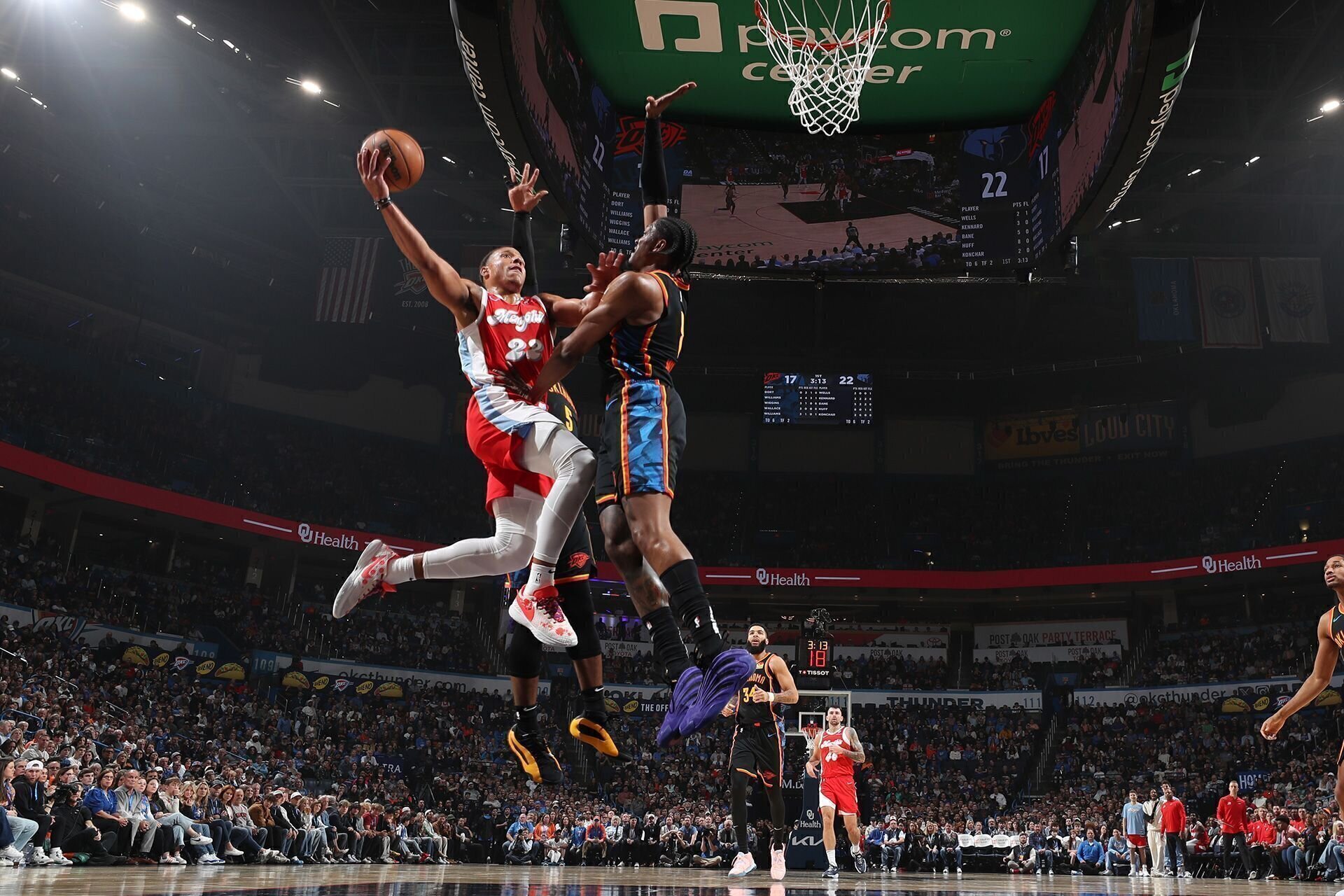 OKLAHOMA CITY, OK - DECEMBER 29: Desmond Bane #22 of the Memphis Grizzlies drives to the basket during the game against the Oklahoma City Thunder on December 29, 2024 at Paycom Center in Oklahoma City, Oklahoma.