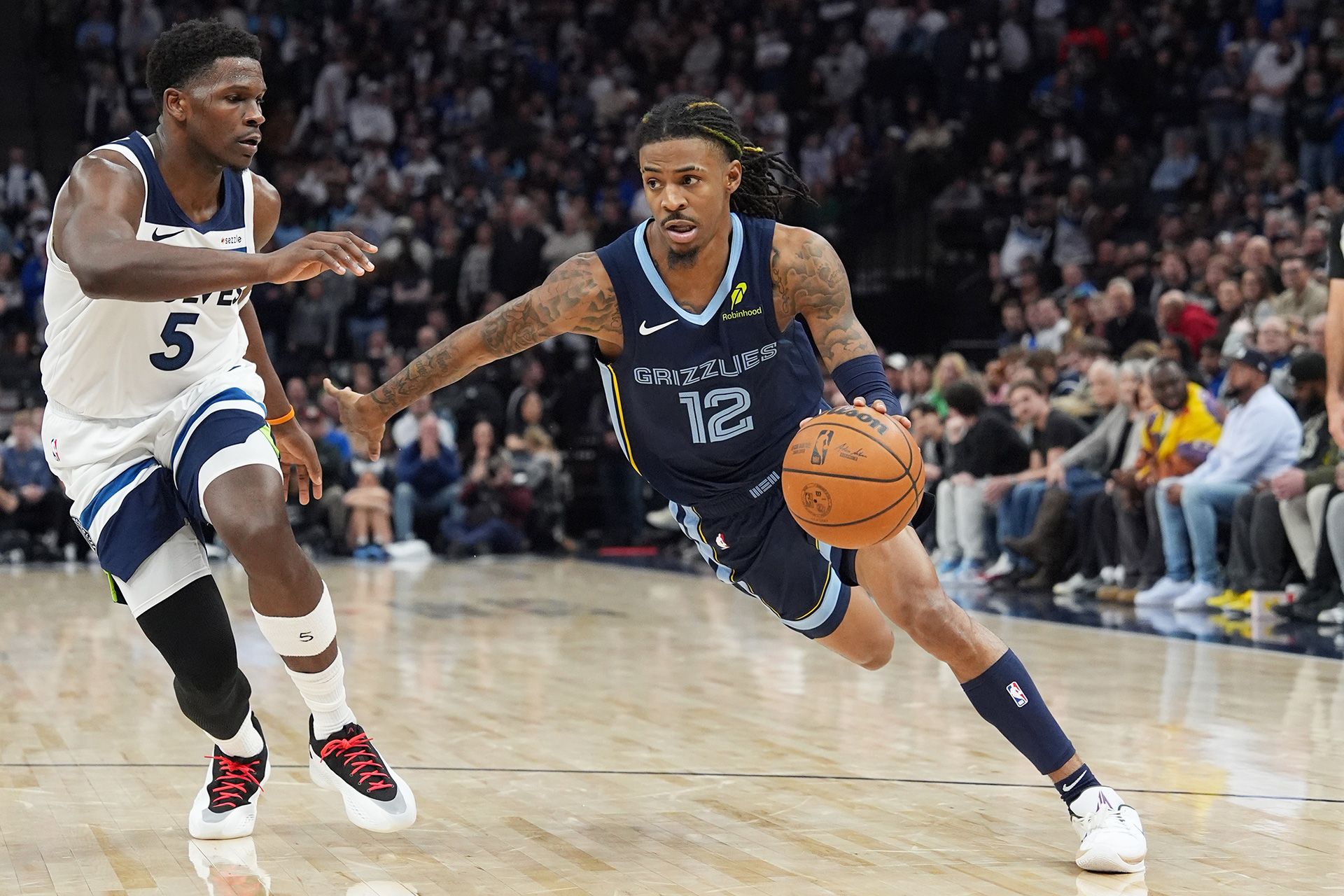 MINNEAPOLIS, MN -  JANUARY 11: Ja Morant #12 of the Memphis Grizzlies drives to the basket during the game against the Minnesota Timberwolves on January 11, 2025 at Target Center in Minneapolis, Minnesota.