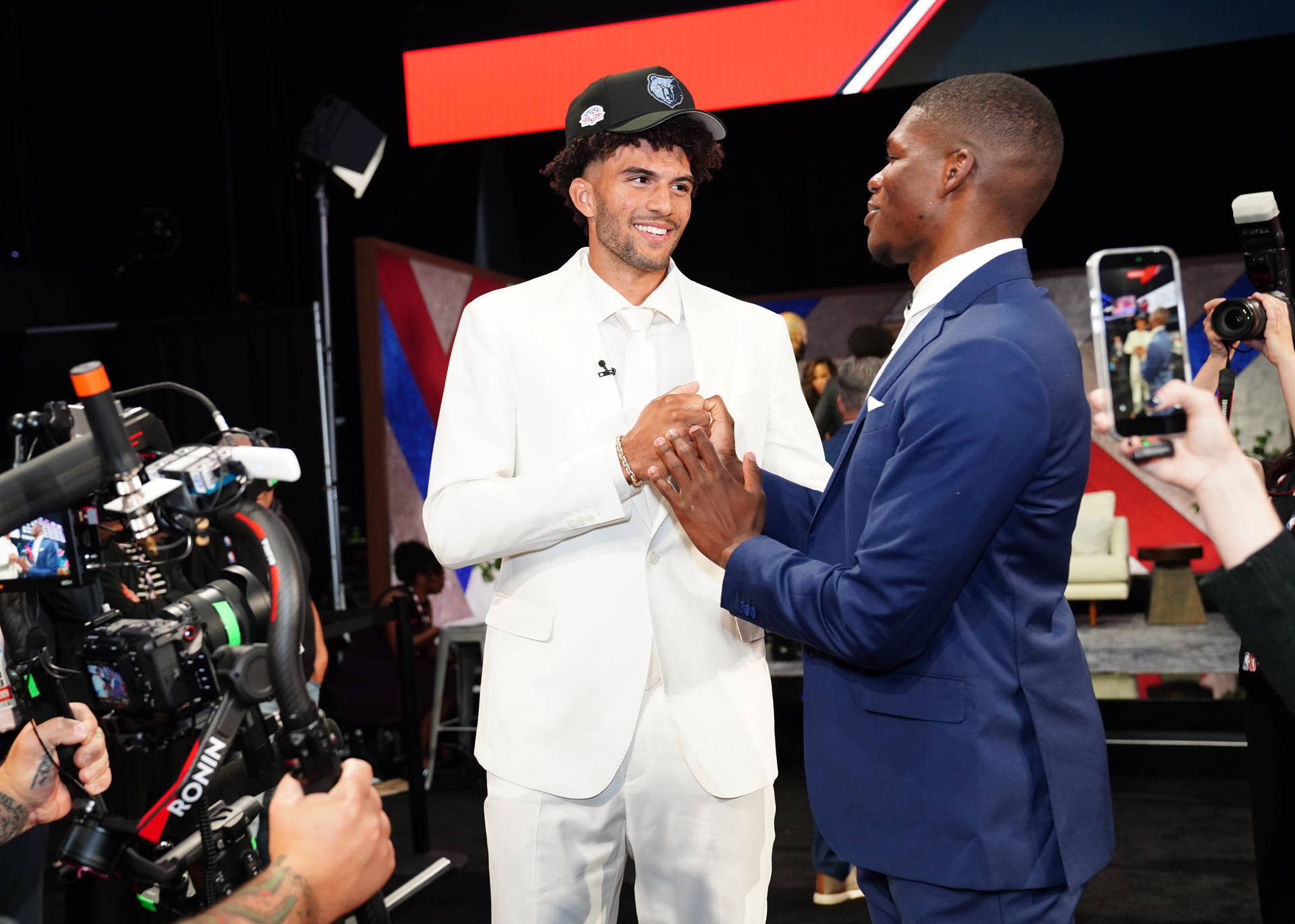 BROOKLYN, NY - JUNE 23: Cameron Boozer of the Memphis Grizzlies and Cedric Coward #23 of the Memphis Grizzlies shake hands during the 2026 NBA Draft - Round One on June 23, 2026 at Barclays Center in Brooklyn, New York.
